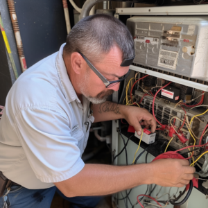 HVAC technician performing system maintenance